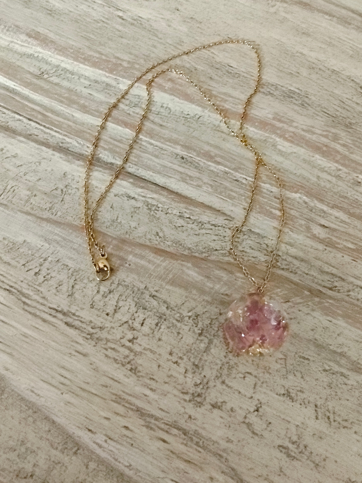 Collier boule rose doré